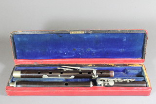 A wooden 3 section flute, cased