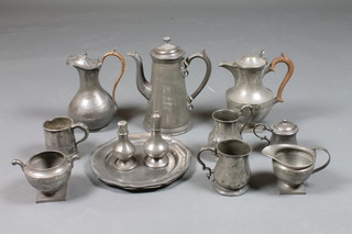 2 circular pewter plates with bracketed borders, the reverse  marked J D, 9", 2 pewter pepperettes, jugs etc