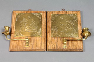 A pair of Art Nouveau oak and brass candle sconces decorated  birds 10"