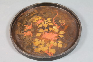 A circular lacquered tray with floral decoration 21"
