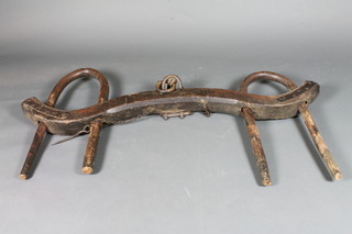 A pair of Eastern iron and wooden "oxon" yokes
