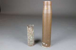 A large brass shell case and a Trench Art shell case with vineous decoration marked LB