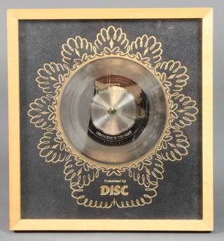 A Frank Sinatra "gold" record disc, awarded to Frank Sinatra  for his Reprise Recording of Strangers in the Night, 7"   ILLUSTRATED