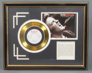 A facsimile Elvis Presley "gold" record disc for Heart Break Hotel  ILLUSTRATED