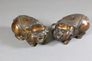 A pair of bronze figures of pigs 4"