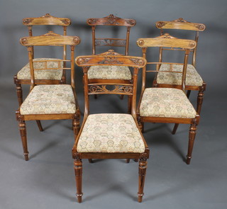 A set of of 6 William IV rosewood dining chairs with bell flower  relief carved cresting rails, pierced spars, Trafalgar drop in seats  on lappette carved legs