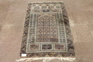 A red ground Turkish prayer rug, the field with geometric  hooked motifs, multi bordered and fringed, 68"l x 41"w