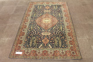 An Isphahan style blue ground carpet having central geometric lozenge motif to a foliate field, multi bordered, 90"l x 55"w