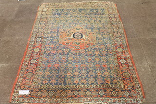 A Caucasian blue and red ground carpet, the geometric foliate  field centred an octagonal motif, multi bordered with cropped  fringes, af, 84"l x 55"w