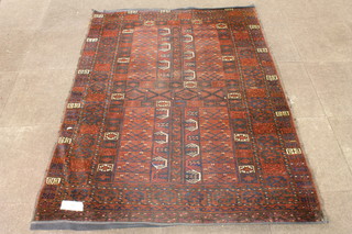 An Afghan red ground Bokhara style carpet with geometric  field, multi bordered, cropped 74"l x 55"w