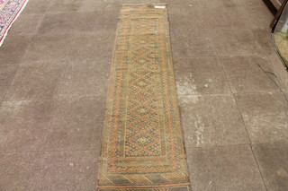A Caucasian flat weave runner, the field decorated a band of floral lozenges within foliate borders, fringed 101"l x 24"w