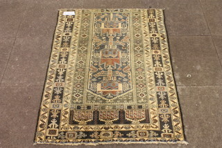 A Kazak style rug, with foliate stylised geometric field, multi bordered and fringed, 50"l x 34"w, cut down