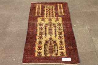 A beige and red ground Caucasian prayer mat, the central  mihrab decorated stylised floral motifs, multi bordered and  fringed 60"l x 34"w