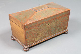 A Victorian rosewood and brass inlaid tea caddy of sarcophagus  form with hinged lid, fitted a brown and green tea caddy, raised  on bun feet 12"w x 6.5"d x 6.5"h