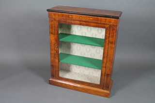 A Victorian walnut pier cabinet, parcel ebonised and boxwood  line inlaid, the glazed door enclosing 2 shelves, raised on plinth  base 39"h x 31"w x 11.5"d