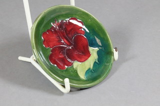 A Moorcroft Pottery dish decorated a pansy, the reverse with  paper label, marked Potter to Queen Mary 3"