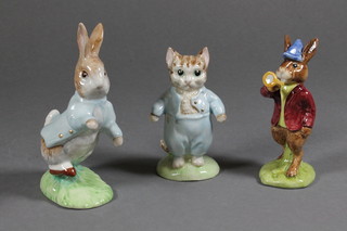 A Beswick Beatrix Potter figure - Tom Kitten with gold  backstamp 1997 together with a Royal Doulton Beatrix Potter figure - Peter Rabbit with gold backstamp 1997 and a Royal  Doulton Bunnykins Rise and Shine figure DB11, with brown  backstamp, boxed