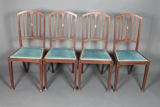 A set of 4 Edwardian mahogany dining chairs, box wood line  inlaid, having blue dralon upholstered seats on square tapered  legs