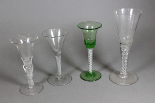 An 18th/19th Century bell shaped glass with air twist stem  together with 3 other air twist glasses