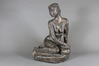 A plaster sculpture of a kneeling lady 12"