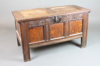 A 17th/18th Century oak coffer of panel construction with iron handle and colonnade front 23"h x 40"w x 19"d