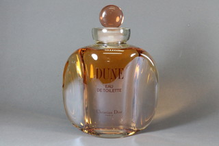 A large shop display glass scent bottle for Dune Eau de Toilette  by Christian Dior 10"