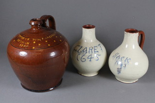 A pair of Dicker Ware jugs marked Sack 1643 and Claret 1645  6.5" together with a Dicker Ware flagon marked Thomas W  Parlington Offham 1786 8"