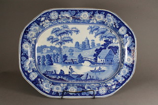 A 19th Century blue and white lozenge shaped meat plate  decorated a boating scene with figures and country house in  distance 21"