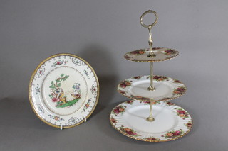 A Spode Cheltenham pattern plate decorated birds 9" and a Royal Albert Old Country Rose 3 tier cake stand