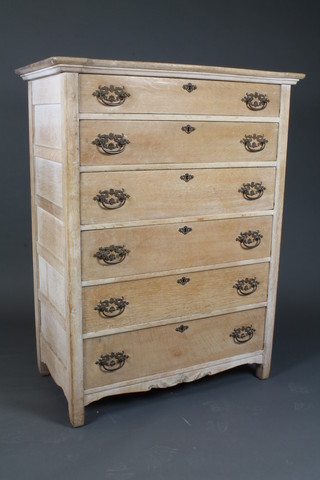 A French limed oak chest of 6 long drawers with pierced brass  drop handles, raised on square supports 52"h x 40"w x 22"d