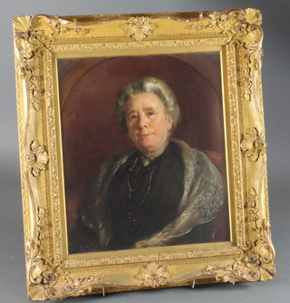 Lance Calkin, British 1859-1936, oil on canvas, an early 20th Century head and shoulder portrait of a lady wearing a black  gown with shawl, signed and dated 1916, 24".75"h x 21"w,  within a foliate carved giltwood frame 35.5"h x 32"w