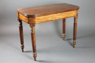 A Georgian mahogany D shaped tea table, raised on turned  chamfered supports 29"h x 37"w x 18"d