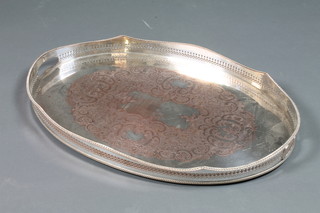 An oval galleried silver plated twin handled tea tray 24"