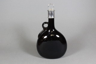 A Victorian brown glass decanter with silver rim, London 1881