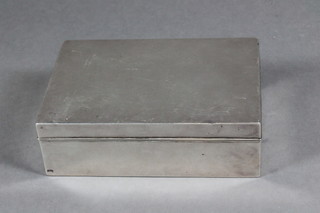 A rectangular plain silver cigarette box with hinged lid 5"