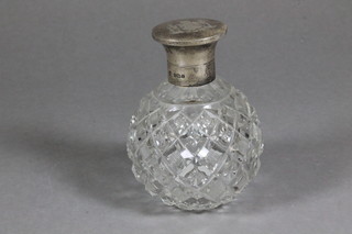 A globular cut glass scent bottle with silver collar, engraved The Arms of the Worshipful Company of Carpenters, Birmingham  1924, 2"