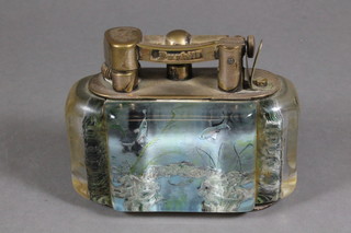 A Dunhill Aquarium table lighter with silver plated mechanism,  RD no. 737415 and decorated 4 lucite panels of fish and seaweed  in a sub-aquatic setting, 3.25"h x 4"l  ILLUSTRATED