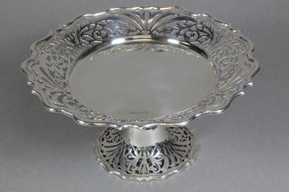 A circular pierced silver dish, raised on a spreading foot, Sheffield 1911, 13 ozs