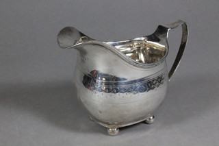 A George III engraved silver cream jug, raised on 3 bun feet,  London 1813, 4 ozs
