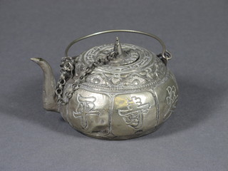 A circular embossed Oriental white metal teapot, the base with character mark 3"
