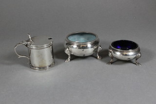 A circular silver salt Birmingham 1924, 1 other silver salt, marks rubbed, a silver mustard pot Birmingham 1964, 8 ozs
