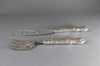A pair of Victorian pierced silver handled fish servers, London 1856
