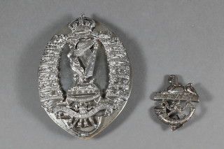 A silver Royal Irish Rifles officer's cross belt badge, together with a silver officer's pouch belt badge Birmingham 1932   ILLUSTRATED