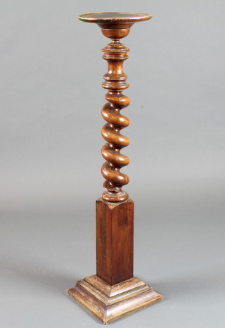A Victorian turned walnut torchere with barley twist column supports 40"h x 9"diam.