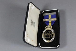 An Elizabeth II issue Army Emergency Reserve decoration, dated  1958 together with bar dated 1958, cased  ILLUSTRATED