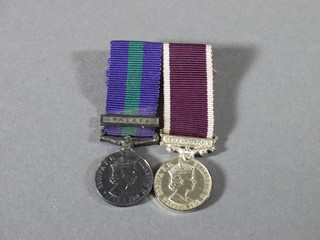 A pair of miniature medals comprising Army RAF General  Service medal 1 bar Malaya, together with Army Long Service  Good Conduct medal