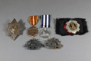 A facsimile Egypt medal, a Dunkirk medal, a large Coldstream  guards cap badge, a Royal Scots cap badge etc