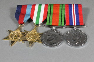 A group of 4 facsimile WWII medals comprising 1939-45 Star,  Italy Star, Defence and War medal