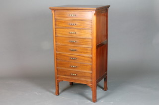 A 1920's mahogany music cabinet fitted 8 fall front long  drawers, raised on chamfered legs 40"h x 21.5"w