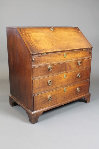 A George II oak bureau, the fall enclosing a fitted interior with well and mounted a tooled green leather skiver above 2 short and  2 graduated long drawers, raised on shaped bracket feet 3'h x  33"w x 21"d